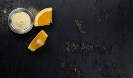 Portion of fresh made Orange Powder as detailed close-up shot (selective focus)の写真素材