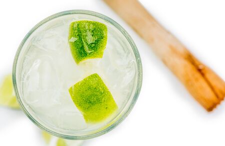 Caipirinha as detailed close-up shot isolated on white background (selective focus)