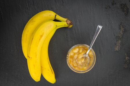 Mashed Bananas (on a vintage slate slab) as detailed close-up shotの写真素材