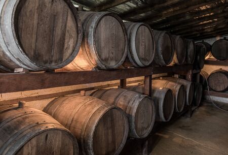 Wooden barrels with Cachaca in a destillery near Paraty, Brazil