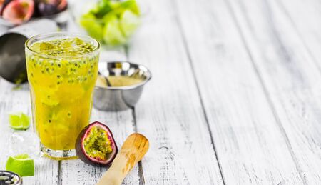Vintage wooden table with Jorge Amado Cocktail (selective focus; close-up shot)の写真素材