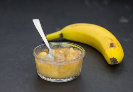 Mashed Bananas on a vintage background as detailed close-up shot (selective focus)の写真素材