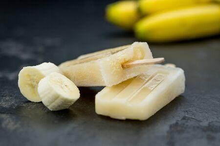 Homemade Banana ice cream on a vintage background (close-up shot; selective focus)の写真素材
