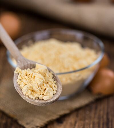 Vintage wooden table with Powdered Eggs (selective focus; close-up shot)の写真素材