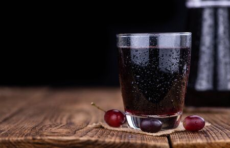 Some fresh Red Grape Juice (selective focus; close-up shot)の写真素材