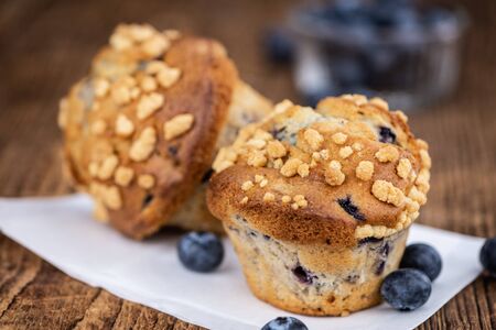 Some fresh Blueberry Muffins (selective focus; close-up shot)の写真素材