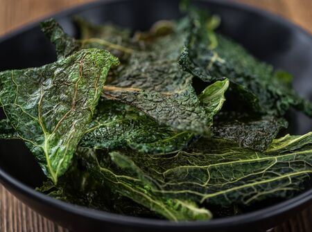Some healthy Savoy Chips (selective focus; close-up shot)