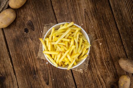 Portion of fresh made crispy French Fries (selective focus; close-up shot)の写真素材