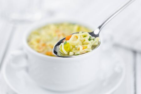 Portion of fresh made Alphabet Soup (selective focus; close-up shot)の写真素材