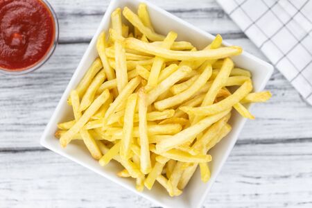 Portion of fresh made French Fries (close-up shot; selective focus)