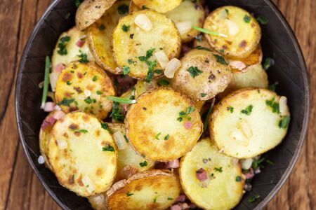 Portion of fresh made Fried Potatoes (selective focus; close-up)の写真素材