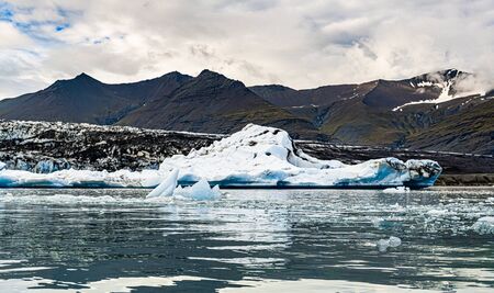 The famous Jokulsarlon Glacier Lagoon in the eastern part of Iceland during a cloudy dayの写真素材