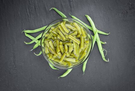 Preserved Green Beans as detailed close-up shot  (selective focus) on vintage backgroundの写真素材