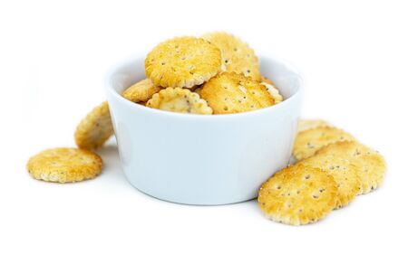 Portion of mixed Snacks isolated on white background (detailed close up shot; selective focus)