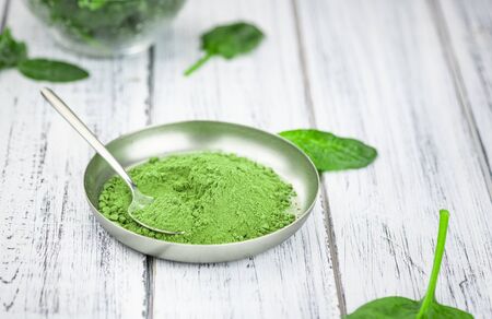 Freshly made green spinach powder (detailed close up shot; selective focus)の写真素材