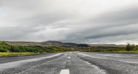 Icelandic street during summer season with spectacular view and green meadowsの写真素材