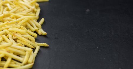 Portion of fresh made crispy French Fries (selective focus; close-up shot)の写真素材
