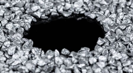 Heap of silver nuggets isolated on black background (close up)の写真素材