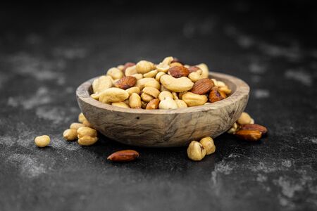 Roasted and salted nuts as detailed close up shot (selective focus)の写真素材
