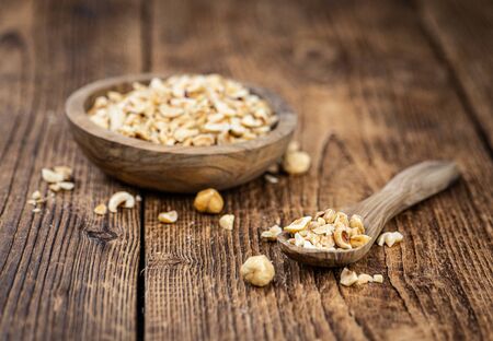 Freshly chopped Hazelnuts as detailed close up shot (selective focus)の写真素材
