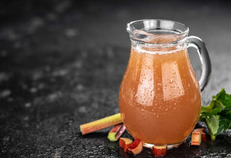 Portion of fresh made Rhubarb Juice (close up shot; selective focus)