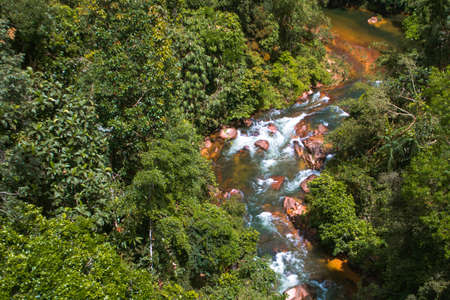 A river flowing in between the greenery of the forest in Kuala Kubu Baru Selangor, north of Kuala Lumpur, an hour and a half away from the heart of the city.の写真素材