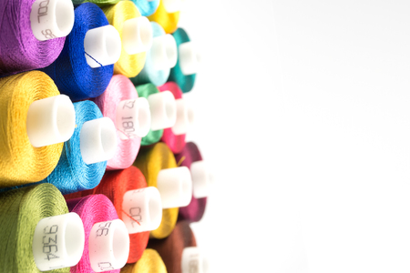Close up of Threads spools use for sewing needlework and embroidery on white backgrounds
