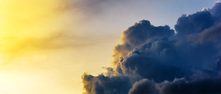 the sunlight on storm cloud sky at morningの写真素材