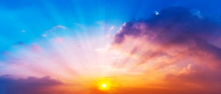 Panorama of gorgeous sun is shining in the twilight sky and colorful clouds, Beautiful nature sceneの写真素材