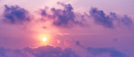 Panorama picture of the sun on the sky and cloud at twilight time purple tone sunrise or sunset sceneの写真素材