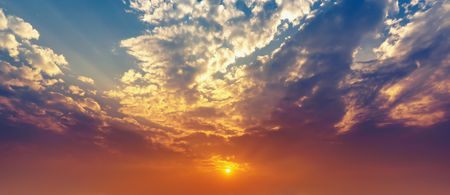 Beautiful nature panorama twilight sky and clouds with sun shining golden light, colorful background の写真素材