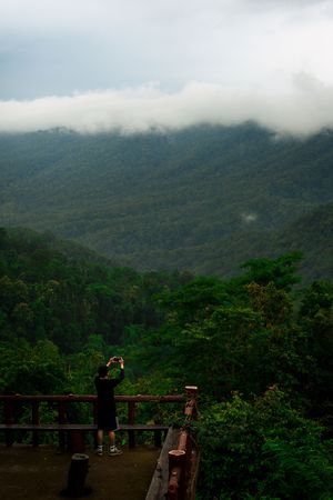 The man taking a picture at view point of Doi Khun Tan National Park