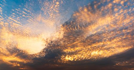 Panorama background of sky and golden clounds at twilight timeの写真素材