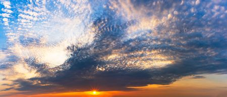 Panorama twilight sky and cloudy with the sun is shinning at sunrise or sunset sceneの写真素材
