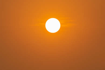 the sun on orange sky nature backgroundの写真素材