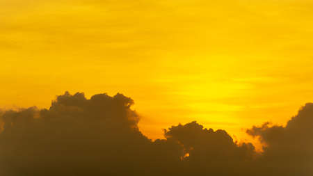 Panoramic golden hour morning orange sky and clouds nature backgroundの写真素材