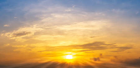 The morning shining sunrise and cloudy golden sky, panoramic backgroundの写真素材