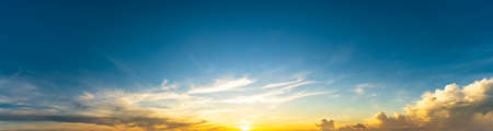 Panoramic view of the blue sky at sunrise with clouds nature backgroundの写真素材
