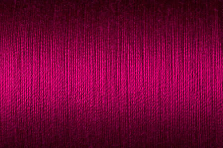 Close up picture of magenta thread texture, elegant surface background imageの写真素材