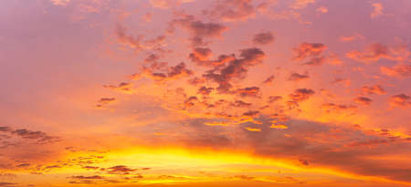 Sweet color golden hour sky and softness clouds and glowing sunlight, panoramic nature backgroundの写真素材