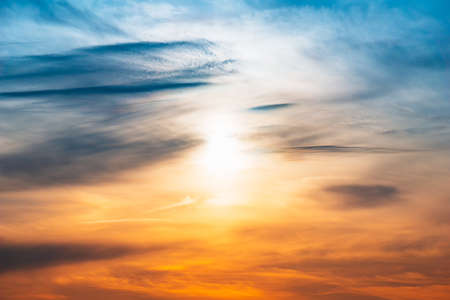 abstract nature illustration of cloudy sky and sun shining.の写真素材