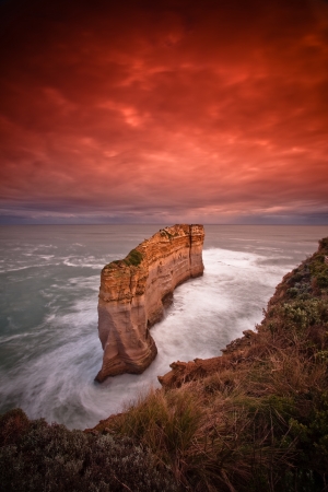 Morning Sunrise at coastal cliff face rock formation of Twelve Apostle, VICの写真素材