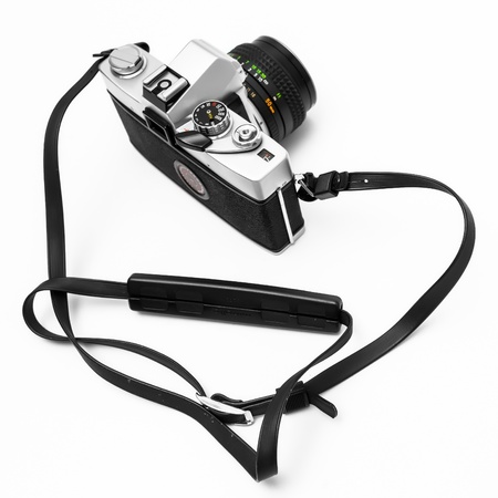 Vintage retro 35mm metal camera SLR on isolated white background.の写真素材