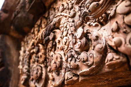 Banteay Srei elaborate carvings on wall are in much more detail than any other temple around Angkor.の写真素材
