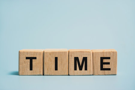 The word time on the wooden block The concept of time cannot be changed.の写真素材