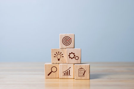 Wood cube block stacking with icon. business strategy and action plan Concept.の写真素材