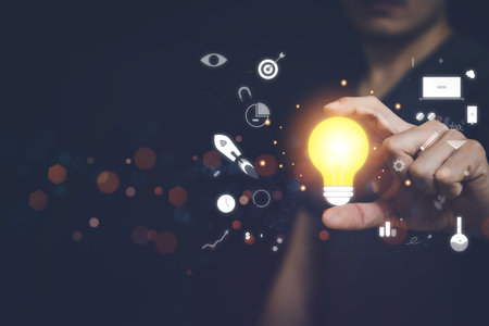 Businessman holding light bulb and infographic creative ideas and innovative conceptの写真素材