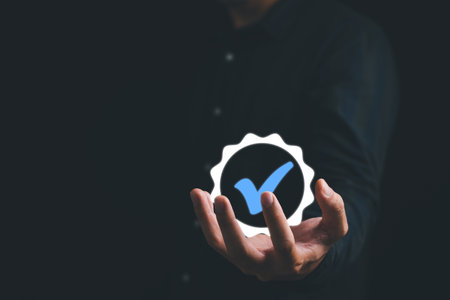 Businessman holding and showing the best quality assurance with golden stars. Quality control certification and standardization. ISO service concept.の写真素材