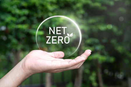 net zero emissions icon concept in hand for environmental policy animation concept illustration Green renewable energy technology for a clean future environment.の写真素材