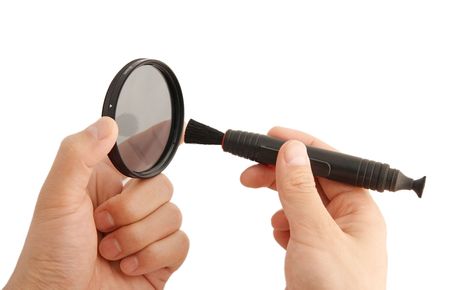 cleaning a filter of camera with a tool,isolated on whiteの写真素材